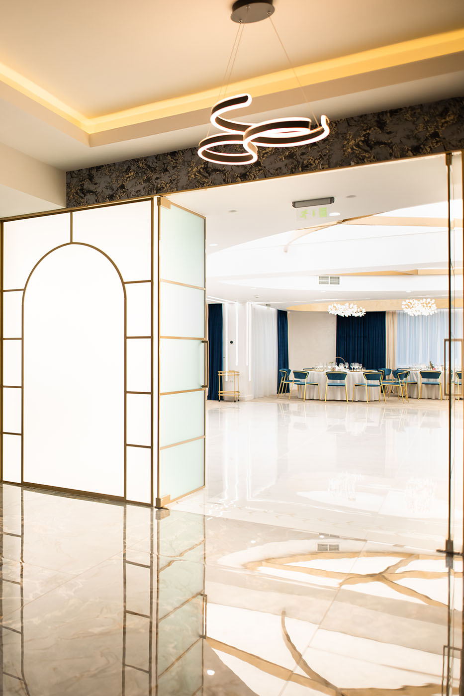 A glass door with a light shining through it in Sibiu hotel.