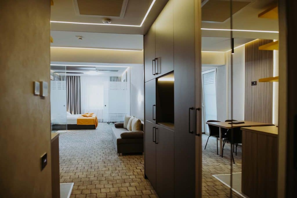 A hotel room with a TV.