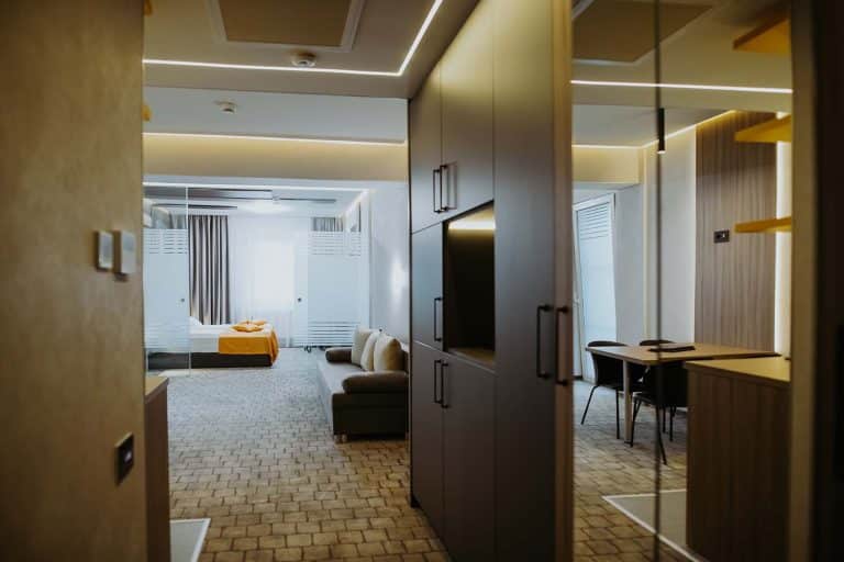 A hotel room with a TV.