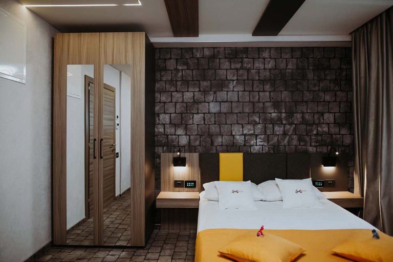 A bed or beds in a hotel room in Sibiu.