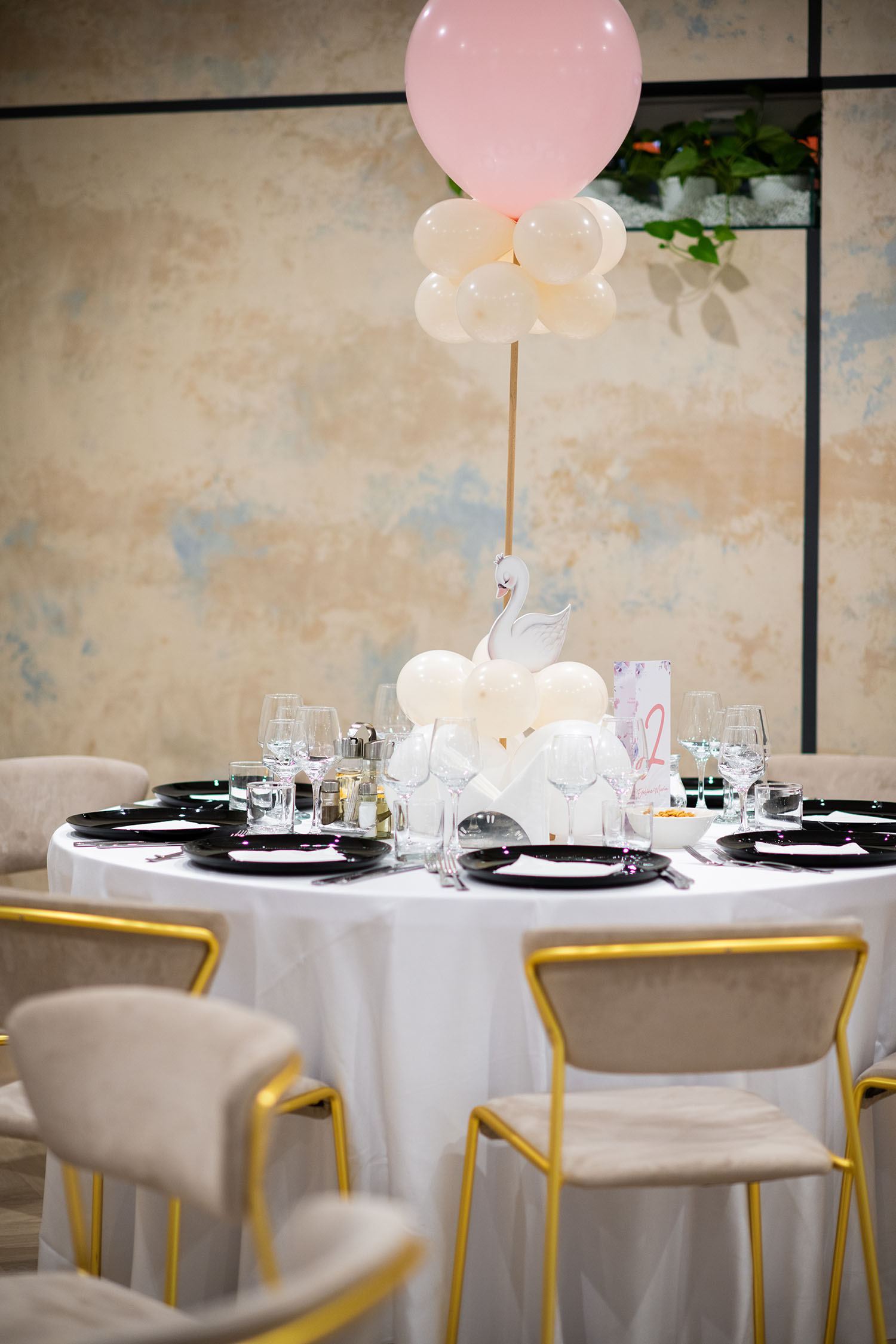 A table setting with white tablecloth at an epic event.